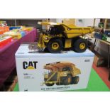 A 1:50 Scale Model of a CAT 797F Tie Mining Truck, by DM Diecast Masters, in yellow with original