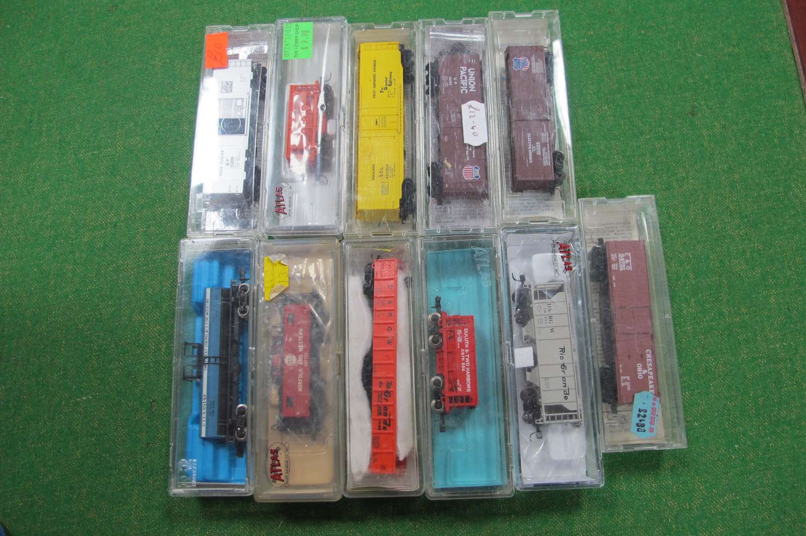 Eleven 'N' Gauge American Outline Eight Wheel Boxcars/Tankers etc, mainly Atlas, used, cased.