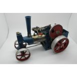 A Wilesco Live Steam Traction Engine, appears complete, including burner, has been steamed,