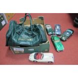 Five 1/18th Scale Model Jaguars, by Burago and others, plus a Jaguar branded bag.