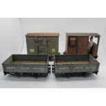 Four Mamod Live Steam Railway Rolling Stock, including two coal wagons, playworn, damaged.