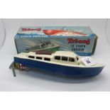 A Tri-ang 11" Cabin Cruiser, clockwork with key and boxed.
