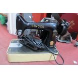 A Singer Sewing Machine. Beaten brass covered fender in the arts and crafts manner. (2)