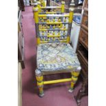 A Set of Four Indian Dining Chairs, yellow painted with braid to seats (damaged)