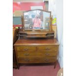 An Edwardian Inlaid Mahogany Dressing Table, with twin jewellery drawers, over four drawers on