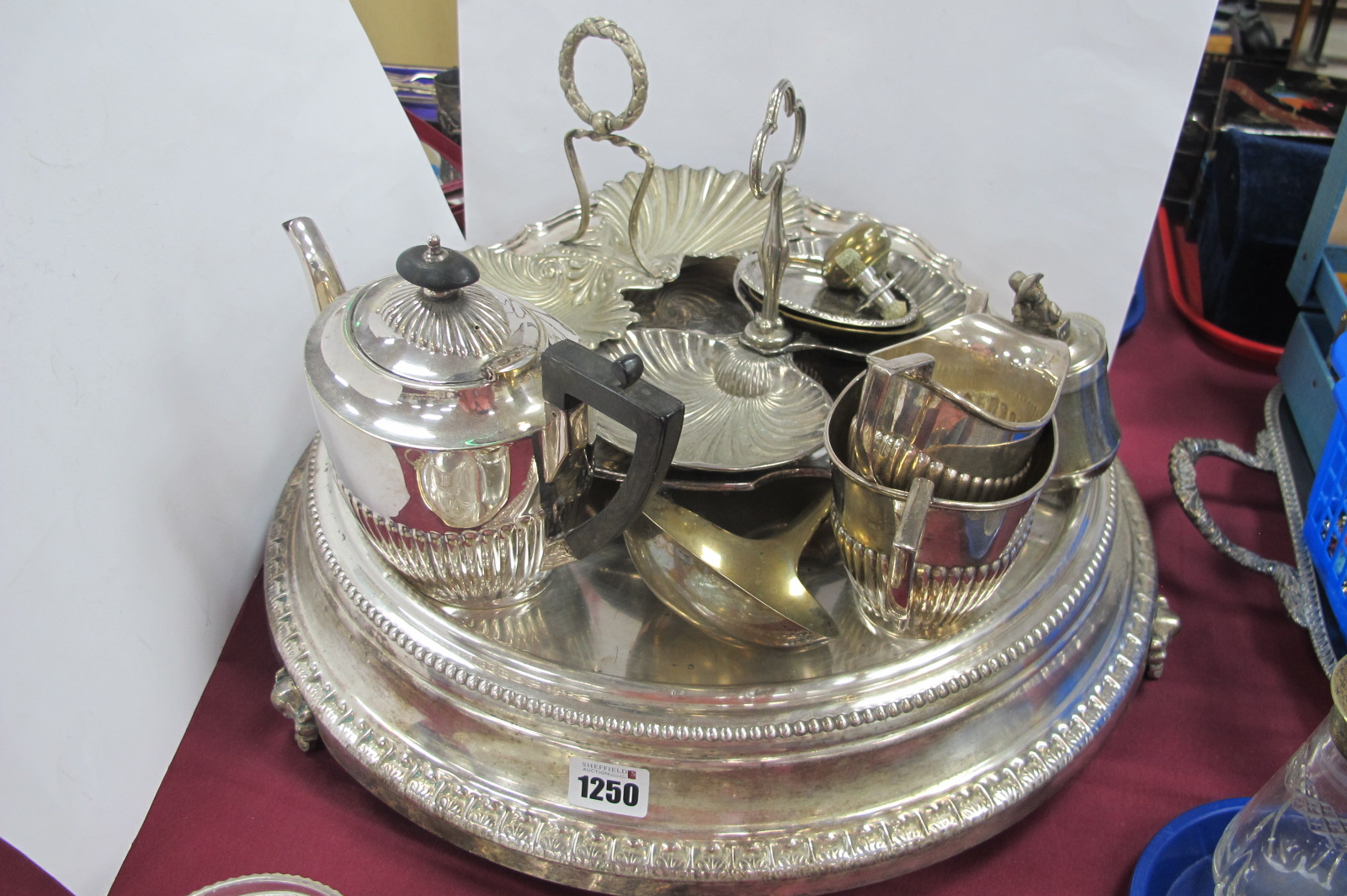 A Plated Wedding Cake Stand, overall diameter of base 46cm, raised on three feet (rust); together