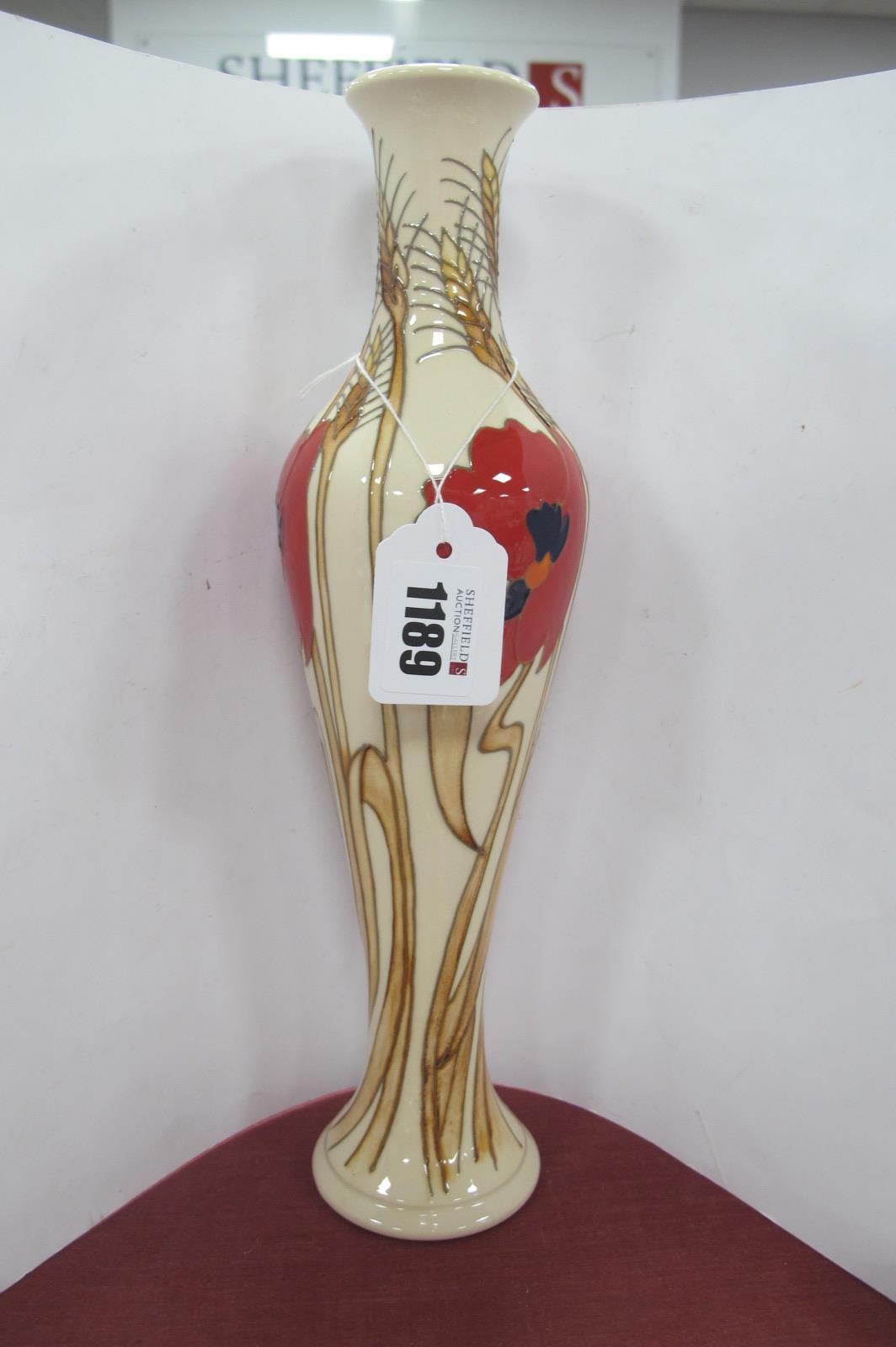 A Moorcroft Vase, painted in the 'Harvest Poppy' design by Emma Bossons, shape 138/12, impressed and