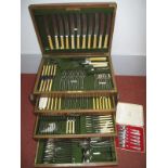 An Oak Cased Canteen of Plated Cutlery, of campaign style with recessed side carrying handles, the