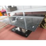 A Black Glass Topped Coffee Table, with twin chrome supports and smaller glass base, 120cm wide.