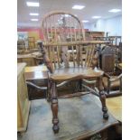 A Mid XIX Century Yew Wood Child's Chair, with a hooped back, pierced splat, turned legs H