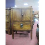 An Early XIX Century Mahogany Commode, having tray top, twin cupboard doors over single drawer, on