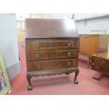 A 1920's Mahogany Bureau, with fall font over three drawers on squat carbiole legs, 77cm wide,