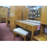 A 1950's Teak Dressing Table with Mirror, of rectangular form with two drawers and plain slightly