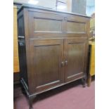 An Early XX Century Mahogany Cupboard, with lift-up lid, fold down flaps and two door cupboard,