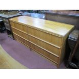 A Teak Wood Sideboard, with six small drawers, on a plinth base.