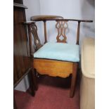 An XVIII Mahogany Corner Chair, with pierced splat's, shaped arms, drop in seat, shaped apron on a