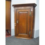 An XVIII Century Flat Fronted Corner Cupboard, with panelled door to two internal shelves.