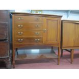 An Edwardian Mahogany Inlaid Music Cabinet, with fall front drawers cupboard door on tapering legs