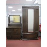 An Early XX Century Oak Dressing Table, together with a matching wardrobe with a single door. (2)