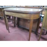 A XIX Century Mahogany Tea Table, with a fold over top, on tapering legs, spade feet, together