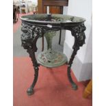 XIX Century Cast Iron Pub Table, with cast heads to shaped legs, with pierced under tier.