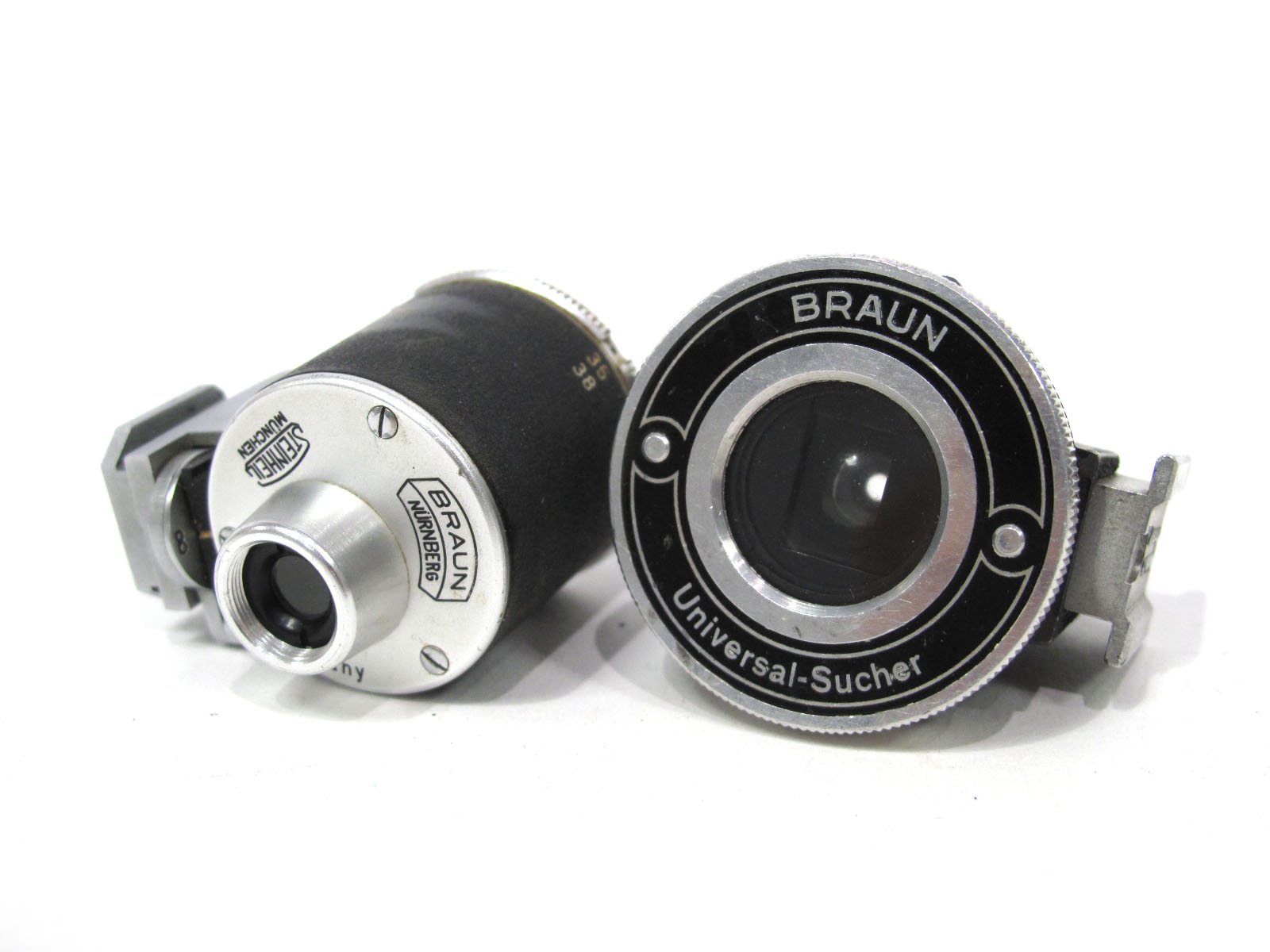 Two Braun Range Finders, in plastic container.