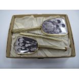 The Beatles Boxed Vanity Set, the backs of hand mirror and brush featuring images of The Fab 4.