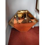 An Art Deco Style Pink Tinted Hexagonal Wall Mirror, with fanned side panels, 71.5 x 54cm.