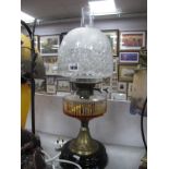 A Late XIX Century Oil Lamp, with fluted clear glass well and etched shade on circular base.