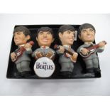 The Beatles, set of 4 plaster figures, each approximately 12cm high.