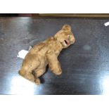 An Early XX Century Plush Wind-up Bear, with key (head wobbles and paws rise up and down when