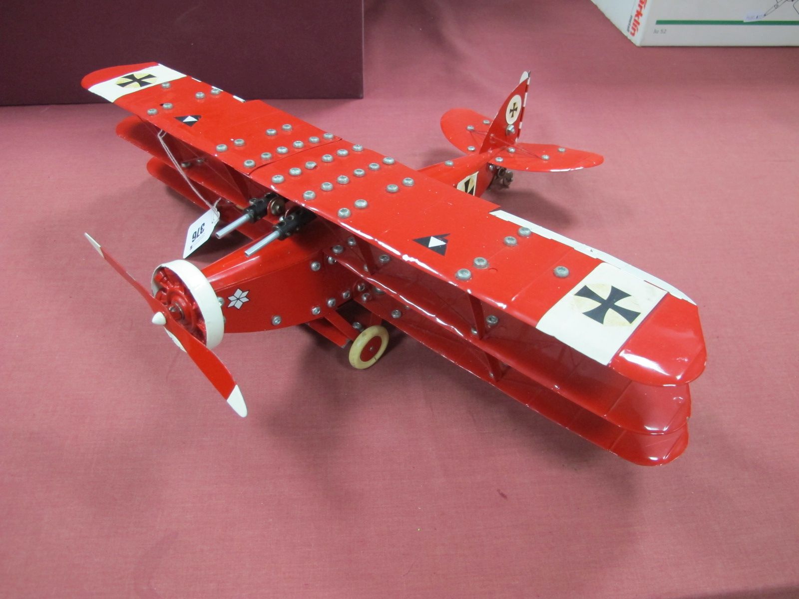 A Meccano Based Model of a German WWI War 'Red Barons' Tri-Plane, with twin guns, pilot. Finished in