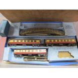 A Hornby Dublo Three Rail Passenger Set, missing locomotive in poor box, plus a quantity of empty