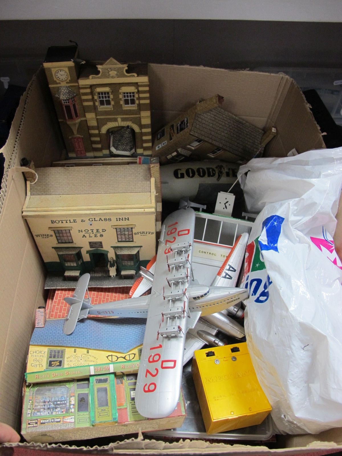 A Quantity of O/1 Gauge Cardboard Scenic Buildings, Plastic Aircraft, and associated items, all