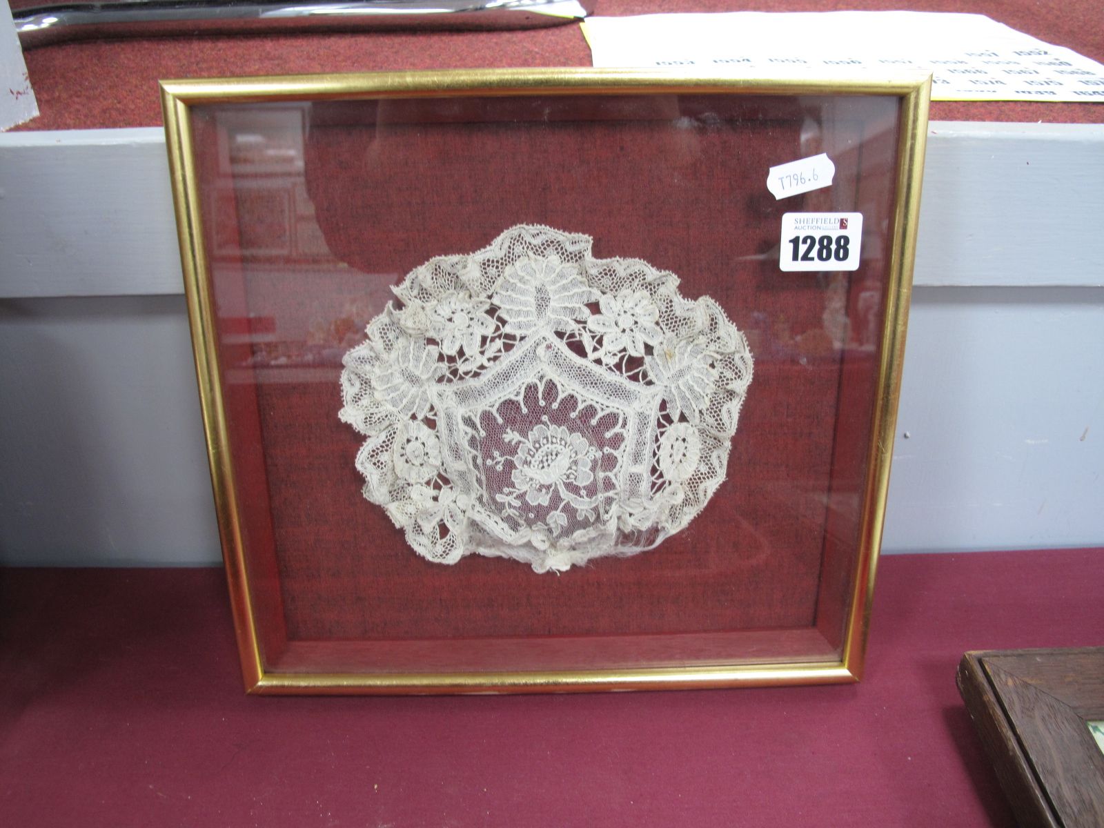 A XIX Century Handmade Lace Baby's Christening Bonnet, mounted, framed and glazed.