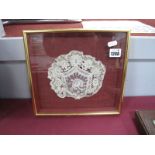 A XIX Century Handmade Lace Baby's Christening Bonnet, mounted, framed and glazed.