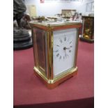 A French Brass Cased Carriage Clock, with bevelled glass panels, back plate stamped L'Epee over