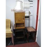 A Mid XX Century Standard Lamp, of Corinthian form, early XX Century oak two tier trolley, a nest of