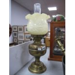 A Brass Oil Lamp, with yellow glass shade.