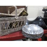 A Leather Horse Saddle, wicker basket, hub caps, pair of brass candlesticks.