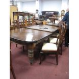 A XIX Century Style Stained Pine Wind Out Table, on turned legs (with an extra leaf), 298cm.