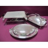 An EPNS Warming Stand, complete with burner together with a rectangular lidded entree dish, raised