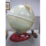 A Mid XX Century Original Light-Up World Globe, on a tinplate base.