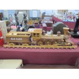 A Wooden Model of a Steam Engine, on a track with a log carrier.