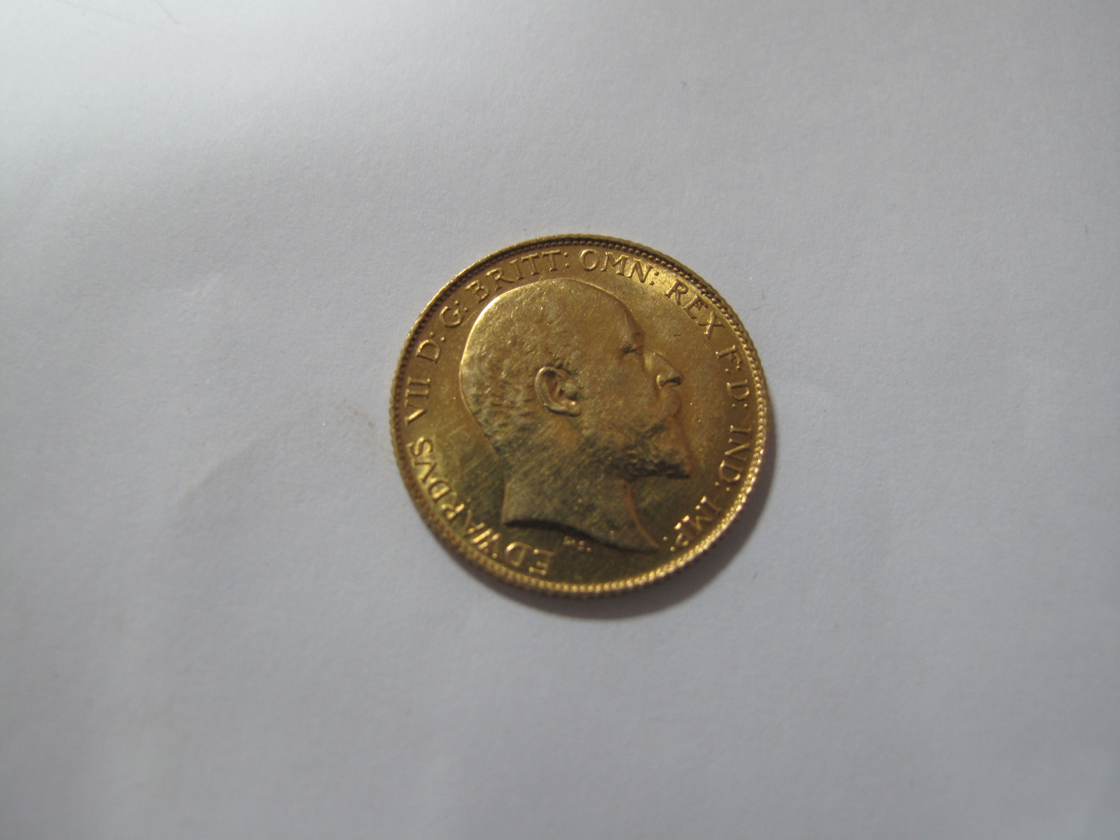 A 1909 Edward VII Gold Half Sovereign.