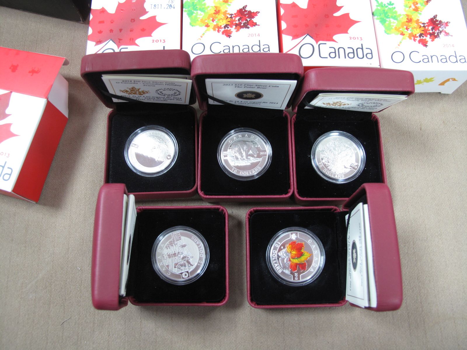 Five Cased 2013/2014 Royal Canadian Mint Fine Silver 10 Dollar Coins, accompanied by literature,