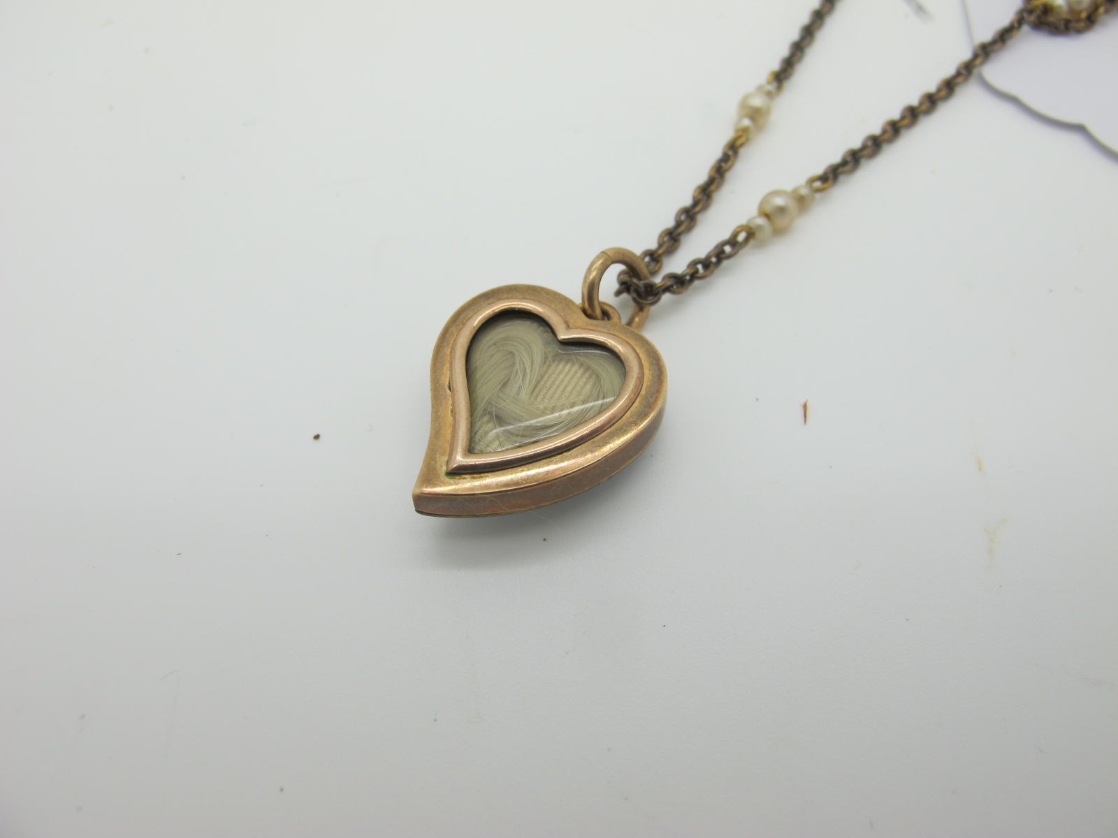 A Pearl Set Heart Shape Locket Pendant, highlighted in turquoise and white enamel, the glazed - Image 2 of 4