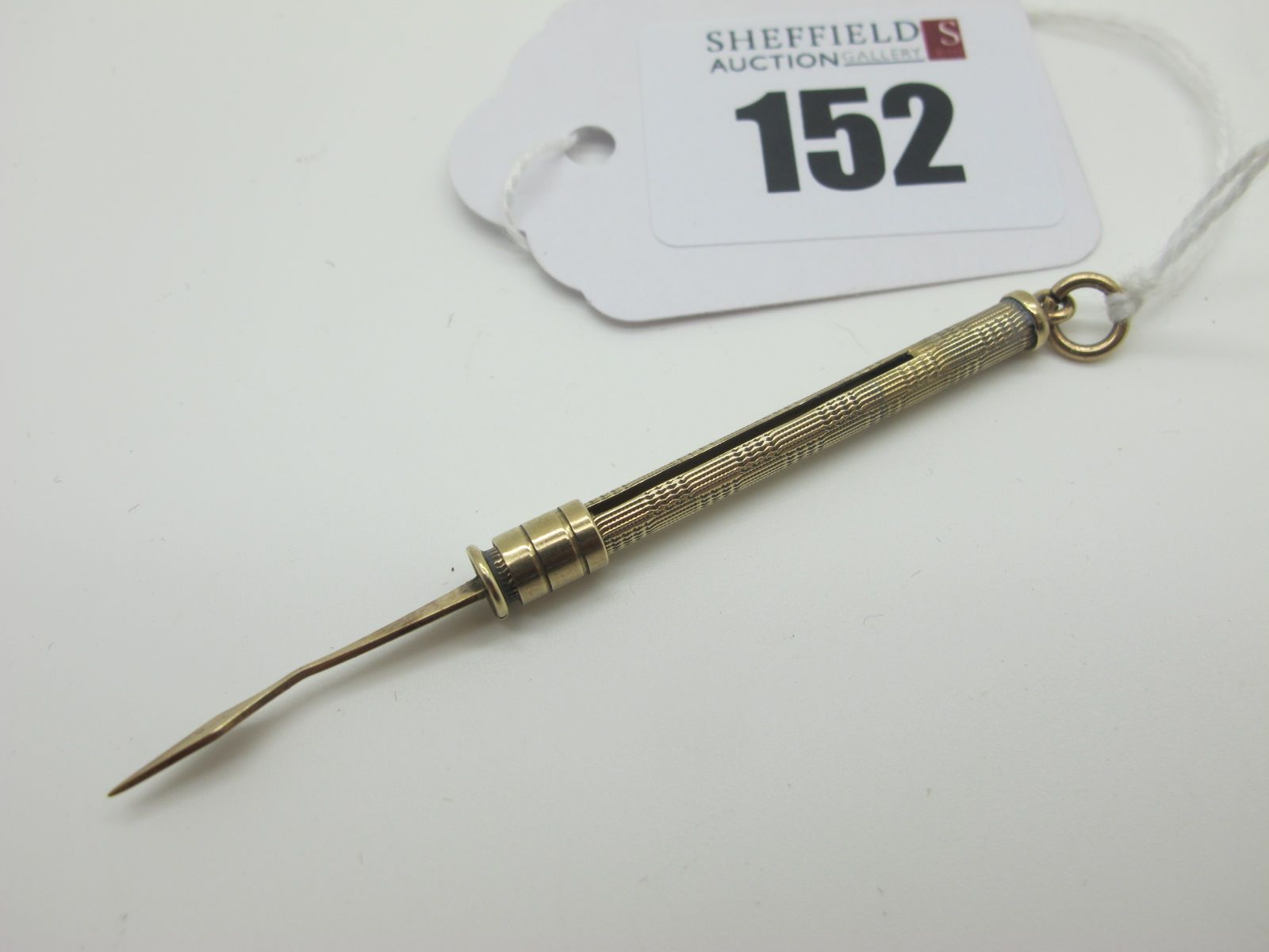 A 9ct Gold Sliding Toothpick, open length approximately 7cm (overall weight 2.3grams).