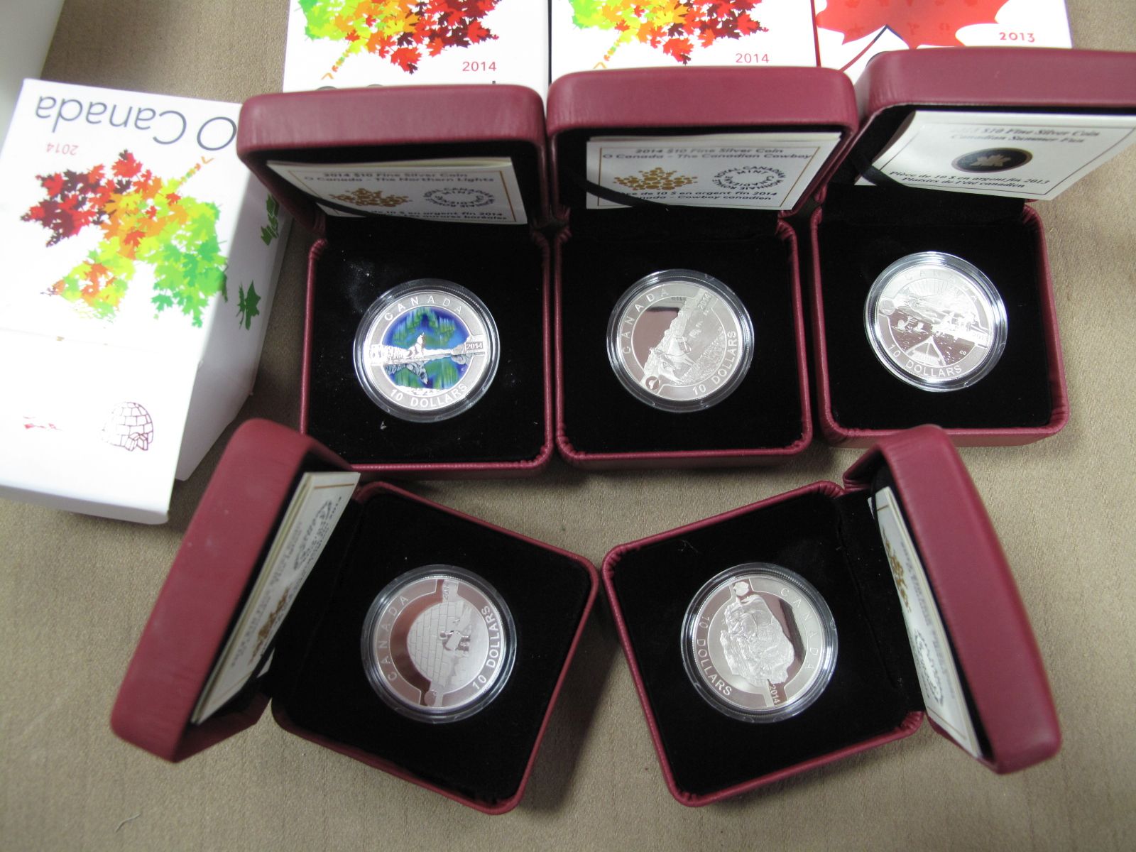 Five Cased 2013/2014 Royal Canadian Mint Fine Silver 10 Dollar Coins, accompanied by literature,