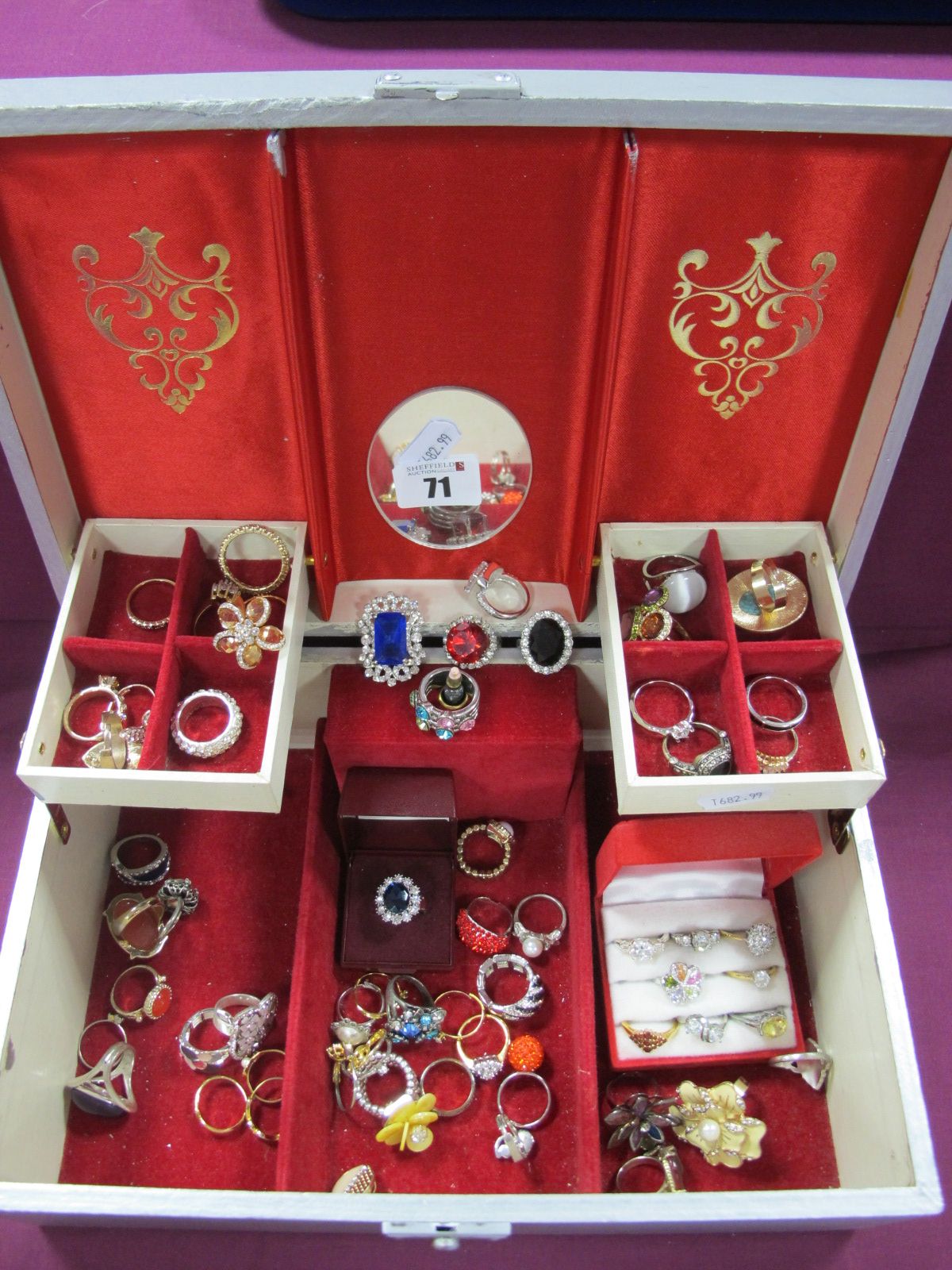 A Collection of Assorted Dress Rings, including "M&S", etc, contained in a jewellery box.